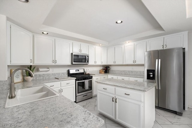 9604 Summer Cypress St, Las Vegas, NV 89123 - kitchen with stainless steel appliances, light marble finish floors, recessed lighting, a raised ceiling, and a center island