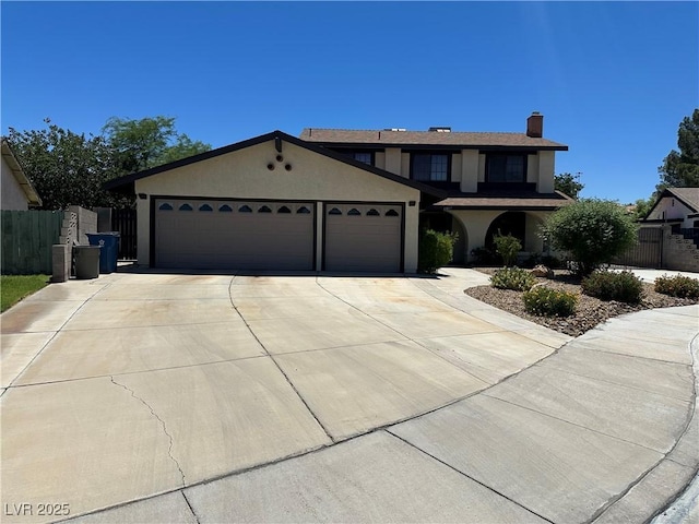 6817 Neepawa Cir, Las Vegas, NV 89108 - traditional-style house with a garage, driveway, stucco siding, and a chimney