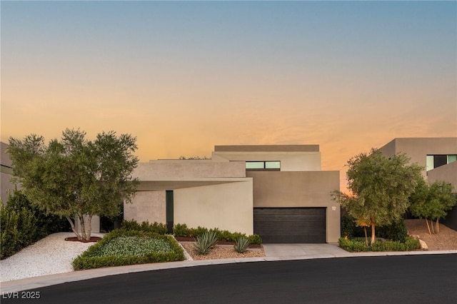 12 Desert Lake Ln, Henderson, NV 89011 - contemporary home with stucco siding, a garage, and concrete driveway