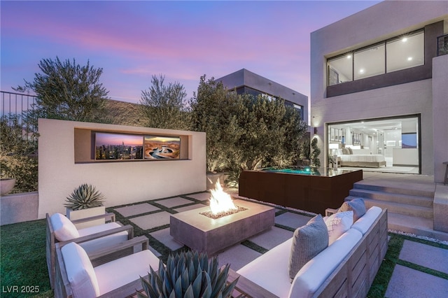 12 Desert Lake Ln, Henderson, NV 89011 - view of patio with an outdoor living space with a fire pit