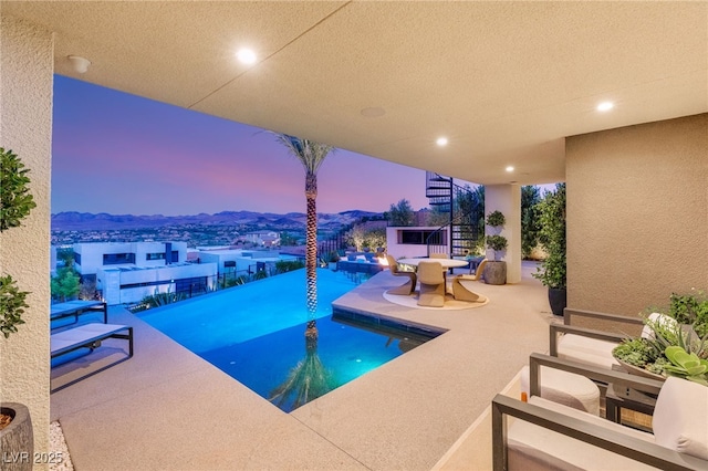 12 Desert Lake Ln, Henderson, NV 89011 - view of swimming pool with stairs, a patio area, and an infinity pool