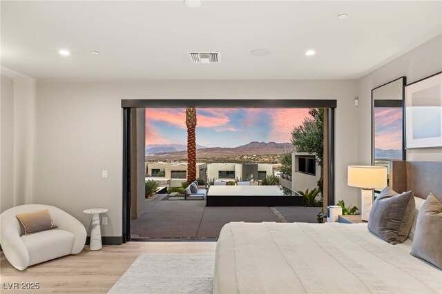 12 Desert Lake Ln, Henderson, NV 89011 - bedroom with wood finished floors, access to exterior, recessed lighting, and a mountain view