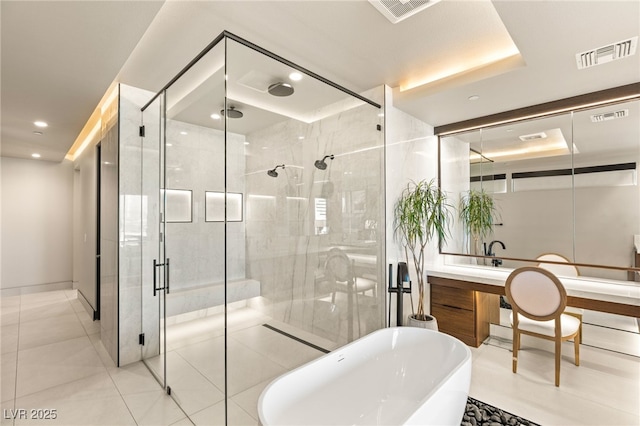 12 Desert Lake Ln, Henderson, NV 89011 - bathroom featuring a freestanding tub, a shower stall, vanity, tile patterned floors, and recessed lighting