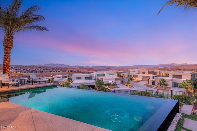 12 Desert Lake Ln, Henderson, NV 89011 - pool at dusk featuring a mountain view