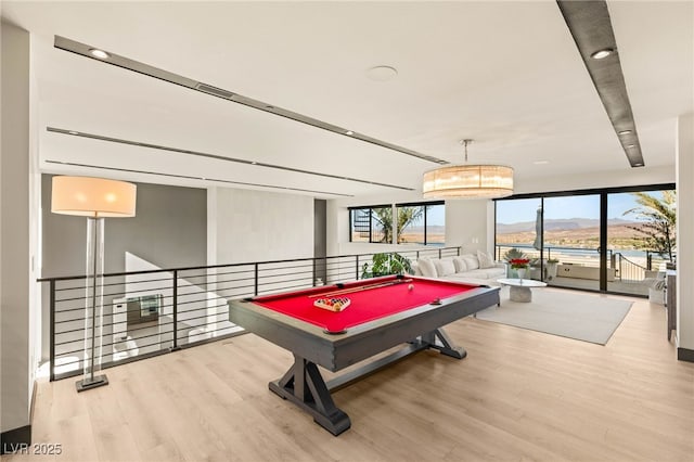 12 Desert Lake Ln, Henderson, NV 89011 - recreation room with wood finished floors, pool table, and a wall of windows