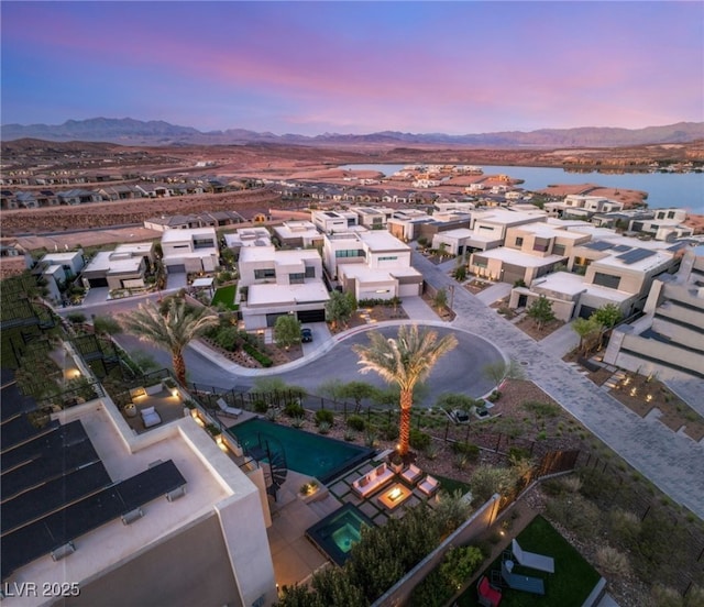 12 Desert Lake Ln, Henderson, NV 89011 - aerial view at dusk of a residential view and a water and mountain view