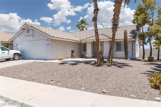 998 Hunters Run Dr, Henderson, NV 89002 - single story home with an attached garage, stucco siding, driveway, and a tiled roof