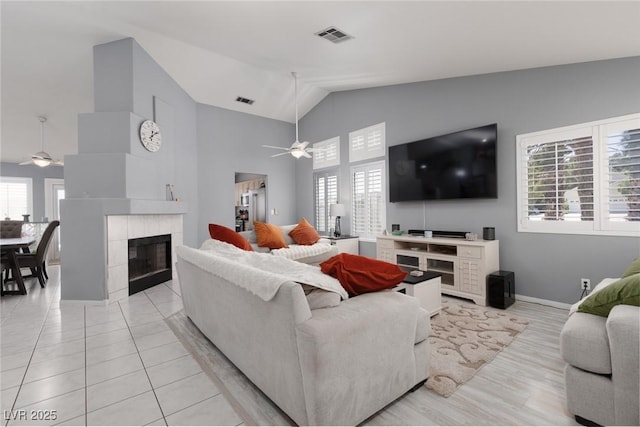 998 Hunters Run Dr, Henderson, NV 89002 - living area featuring a ceiling fan, plenty of natural light, a fireplace, and high vaulted ceiling