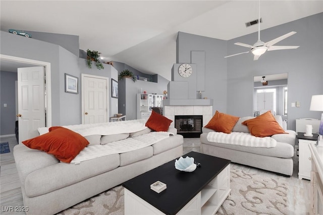 998 Hunters Run Dr, Henderson, NV 89002 - living area featuring lofted ceiling, ceiling fan, and a fireplace