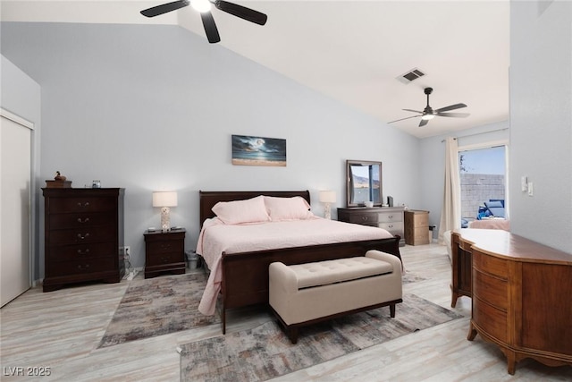 998 Hunters Run Dr, Henderson, NV 89002 - bedroom featuring light wood-type flooring, vaulted ceiling, ceiling fan, and a closet