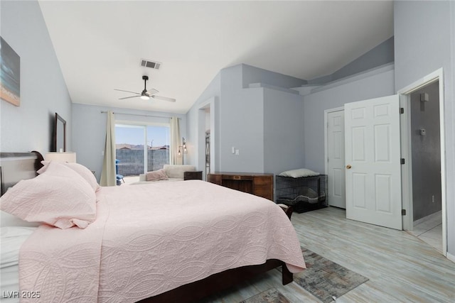 998 Hunters Run Dr, Henderson, NV 89002 - bedroom with vaulted ceiling, light wood finished floors, and a ceiling fan