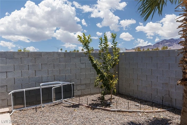 998 Hunters Run Dr, Henderson, NV 89002 - fenced backyard with a mountain view