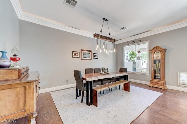 5913 Audria Falls Ave, Las Vegas, NV 89131 - dining space featuring ornamental molding and wood finished floors