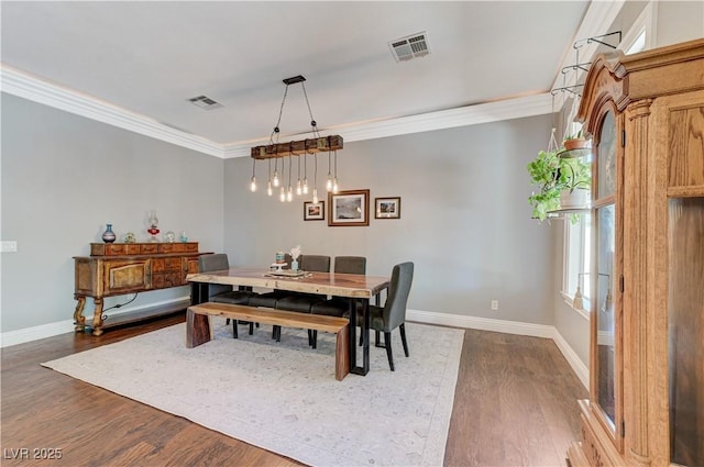 5913 Audria Falls Ave, Las Vegas, NV 89131 - dining space featuring ornamental molding and dark wood-style flooring
