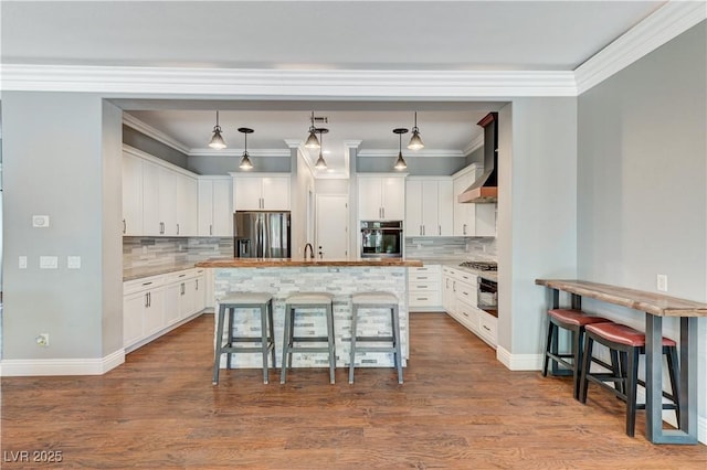 5913 Audria Falls Ave, Las Vegas, NV 89131 - kitchen with appliances with stainless steel finishes, a breakfast bar, white cabinetry, backsplash, and ornamental molding