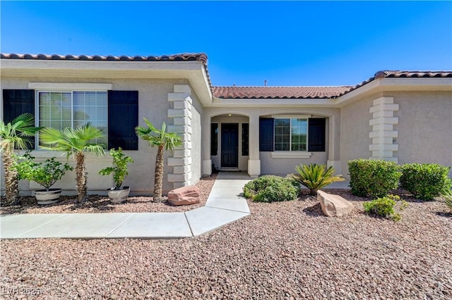 5913 Audria Falls Ave, Las Vegas, NV 89131 - doorway to property with a tiled roof and stucco siding