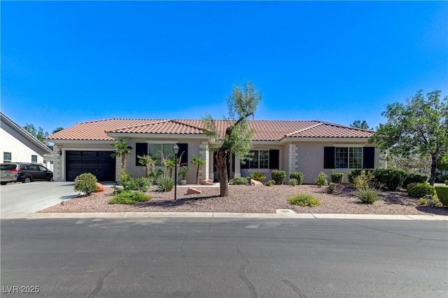 5913 Audria Falls Ave, Las Vegas, NV 89131 - ranch-style house with a tile roof, a garage, stucco siding, and driveway