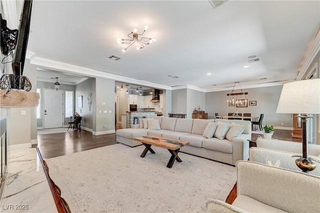 5913 Audria Falls Ave, Las Vegas, NV 89131 - living area with a chandelier, ornamental molding, and recessed lighting