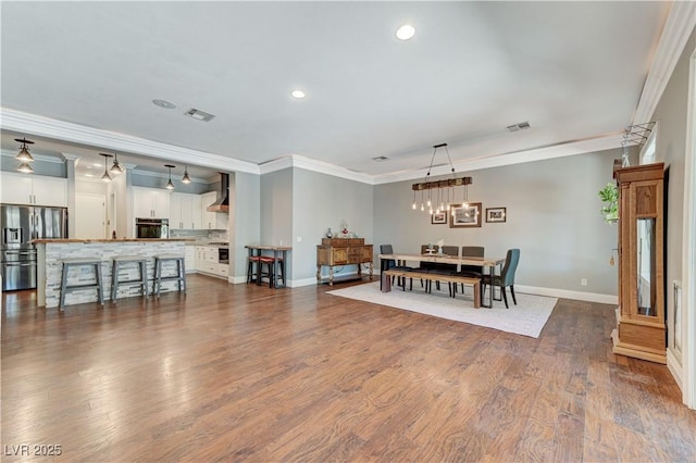 5913 Audria Falls Ave, Las Vegas, NV 89131 - dining space featuring ornamental molding, recessed lighting, and dark wood-type flooring