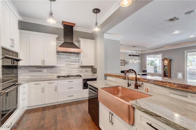 5913 Audria Falls Ave, Las Vegas, NV 89131 - kitchen featuring wall chimney range hood, appliances with stainless steel finishes, ornamental molding, decorative light fixtures, and recessed lighting