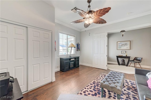 5913 Audria Falls Ave, Las Vegas, NV 89131 - living area with wood finished floors, ceiling fan, and ornamental molding