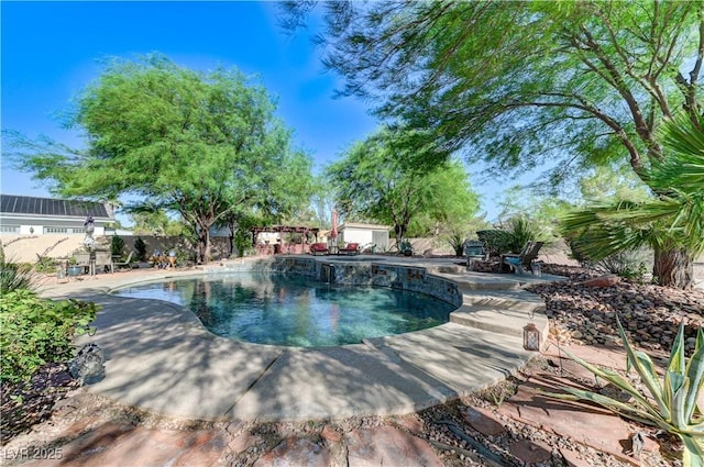 5913 Audria Falls Ave, Las Vegas, NV 89131 - view of swimming pool featuring a patio area, a fenced backyard, and a pool with connected hot tub