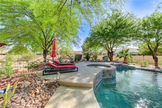 5913 Audria Falls Ave, Las Vegas, NV 89131 - view of swimming pool featuring a fenced backyard, a patio, and a pool with connected hot tub