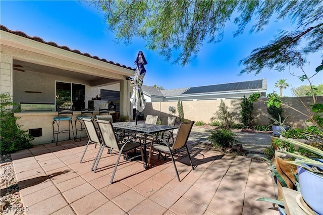 5913 Audria Falls Ave, Las Vegas, NV 89131 - fenced backyard with a patio and outdoor dining area
