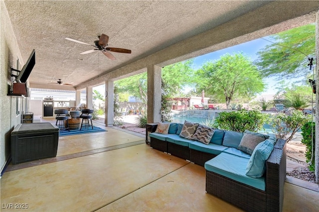 5913 Audria Falls Ave, Las Vegas, NV 89131 - fenced backyard featuring outdoor lounge area, ceiling fan, outdoor dining area, and a patio