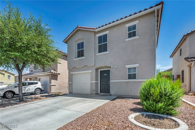6377 W Haleh Ave, Las Vegas, NV 89141 - view of front of home with a tiled roof, stucco siding, a garage, and concrete driveway
