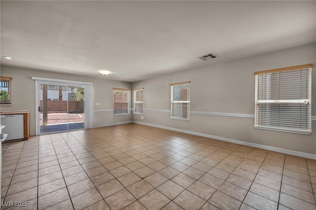 6377 W Haleh Ave, Las Vegas, NV 89141 - spare room featuring light tile patterned floors and baseboards