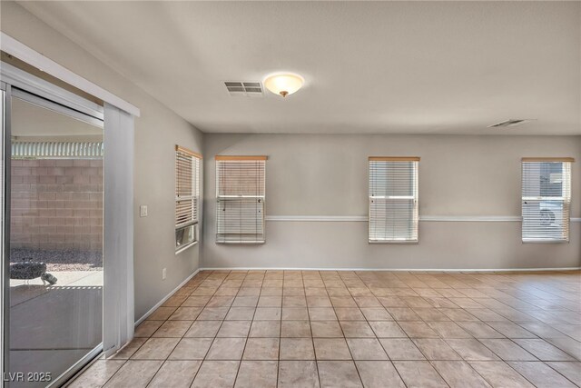 6377 W Haleh Ave, Las Vegas, NV 89141 - empty room featuring light tile patterned flooring and baseboards