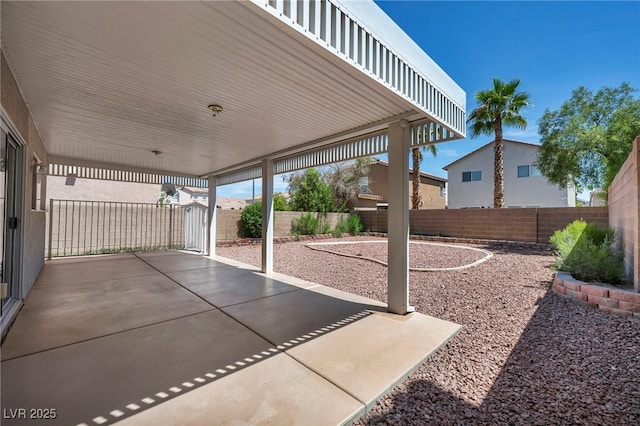 6377 W Haleh Ave, Las Vegas, NV 89141 - fenced backyard with a patio