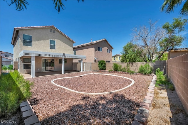 6377 W Haleh Ave, Las Vegas, NV 89141 - rear view of property featuring stucco siding, a patio area, and a fenced backyard