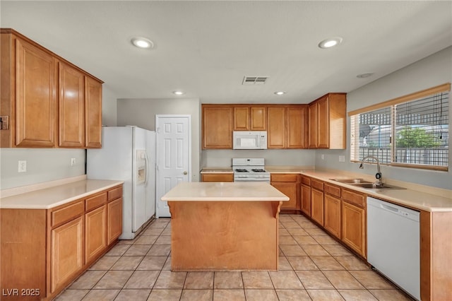 6377 W Haleh Ave, Las Vegas, NV 89141 - kitchen featuring white appliances, a center island, light countertops, recessed lighting, and light tile patterned floors