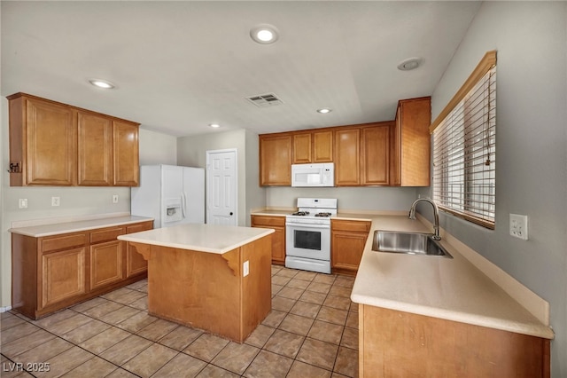 6377 W Haleh Ave, Las Vegas, NV 89141 - kitchen featuring white appliances, a kitchen island, recessed lighting, light tile patterned flooring, and light countertops