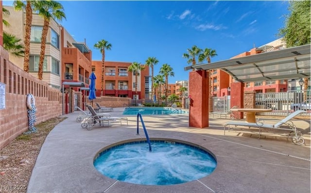 63 E Agate Ave Unit 202, Las Vegas, NV 89123 - community pool with a community hot tub and a patio