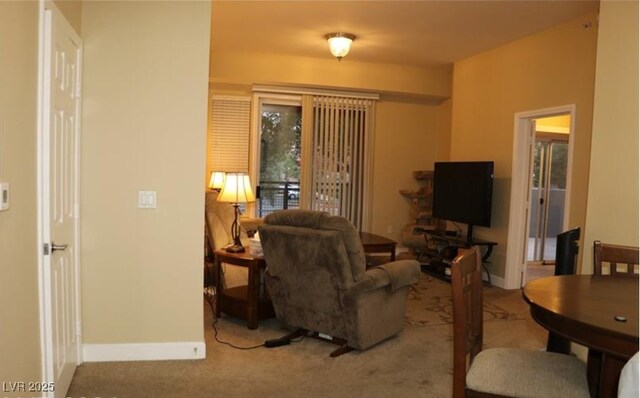 63 E Agate Ave Unit 202, Las Vegas, NV 89123 - carpeted living room featuring baseboards