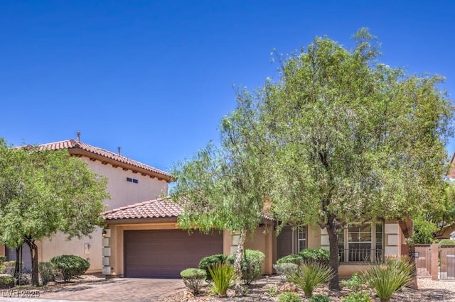 7998 Base Camp Ave, Las Vegas, NV 89178 - view of front facade featuring an attached garage, stucco siding, a tiled roof, and driveway