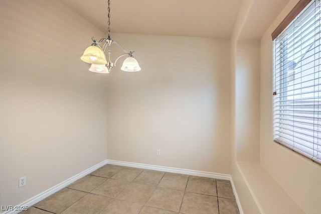 7998 Base Camp Ave, Las Vegas, NV 89178 - unfurnished dining area with a chandelier and light tile patterned floors
