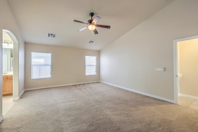 7998 Base Camp Ave, Las Vegas, NV 89178 - unfurnished room featuring ceiling fan, light carpet, and vaulted ceiling