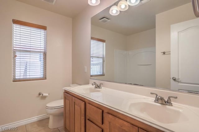 7998 Base Camp Ave, Las Vegas, NV 89178 - full bathroom with tile patterned floors, double vanity, and a shower