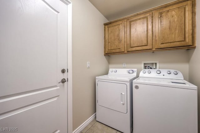 7998 Base Camp Ave, Las Vegas, NV 89178 - laundry area featuring washing machine and dryer, cabinet space, and light tile patterned floors