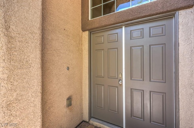 7998 Base Camp Ave, Las Vegas, NV 89178 - doorway to property featuring stucco siding