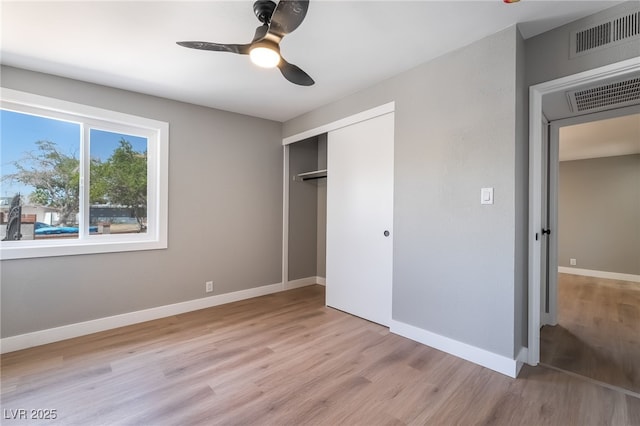 2749 Del Mar Pl, Las Vegas, NV 89169 - unfurnished bedroom with wood finished floors, a closet, and a ceiling fan