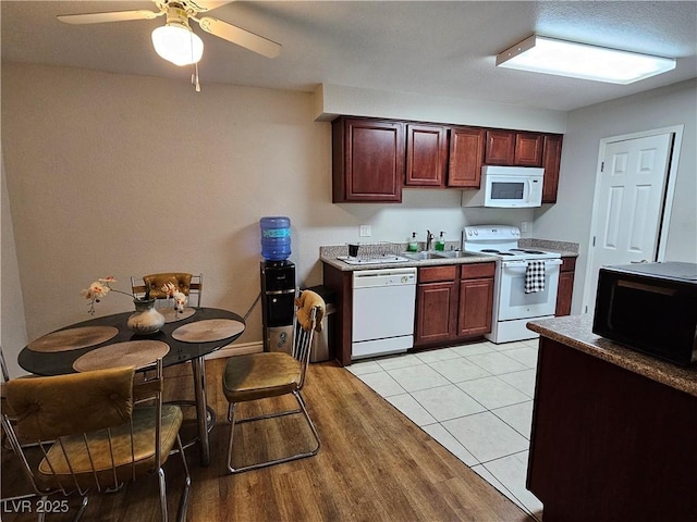 2451 N Rainbow Blvd Unit 1123, Las Vegas, NV 89108 - kitchen featuring white appliances, a ceiling fan, and light countertops