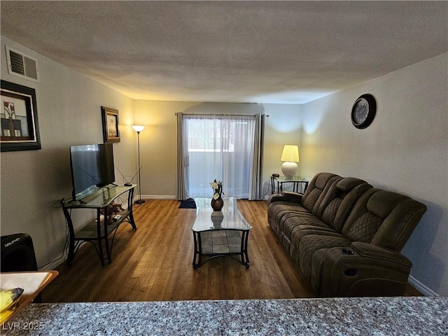 2451 N Rainbow Blvd Unit 1123, Las Vegas, NV 89108 - living area featuring wood finished floors and a textured ceiling