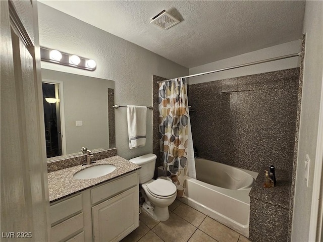 2451 N Rainbow Blvd Unit 1123, Las Vegas, NV 89108 - full bathroom with shower / tub combo, tile patterned floors, vanity, a textured ceiling, and a textured wall