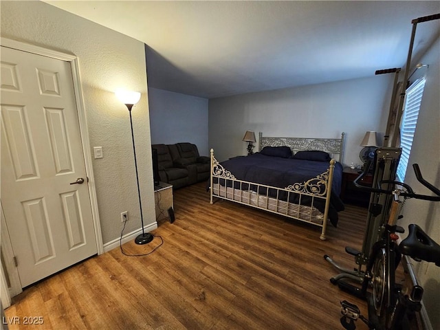 2451 N Rainbow Blvd Unit 1123, Las Vegas, NV 89108 - bedroom with wood finished floors and a textured wall