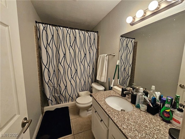 2451 N Rainbow Blvd Unit 1123, Las Vegas, NV 89108 - full bath featuring tile patterned floors, vanity, a shower with curtain, a textured wall, and a textured ceiling